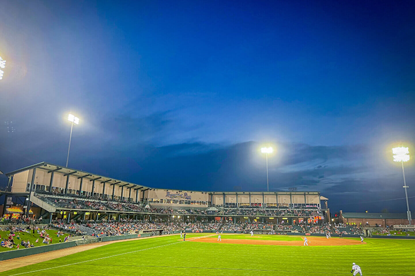 Haymarket Park Baseball Stadium during a night game from the outfield.